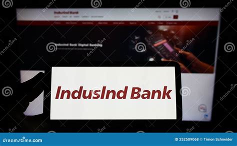 Person Holding Smartphone with Logo of Indinan Financial Company IndusInd Bank Limited on Screen ...