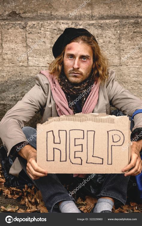 Poor homeless man holding cardboard with text HELP outdoors Stock Photo ...