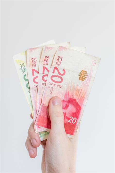 Israeli New Shekel Banknotes in Male Hand Stock Photo - Image of banknotes, finance: 138457192