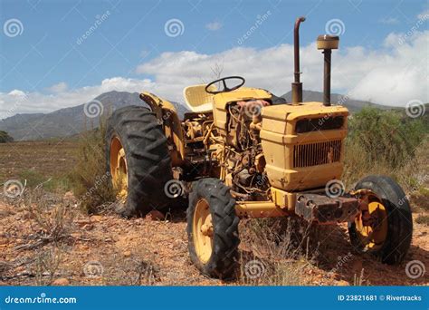 An Old Yellow Tractor Stock Image - Image: 23821681