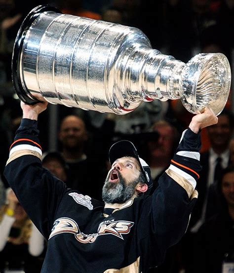 Captain Scott Niedermayer of the Anaheim Ducks hoists the Stanley Cup ...