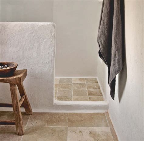 Loving this bathroom with white venetian plaster walls and #travertine tile floors in Unfilled ...