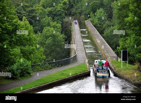 A view of the Llangollen canal aqueduct with a boat approaching it ...