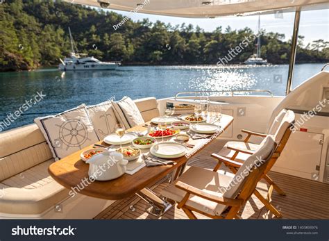 stock-photo-romantic-dinner-on-motor-yacht-at-sunset-table-setting-at-a-luxury-yacht-1403893976 ...