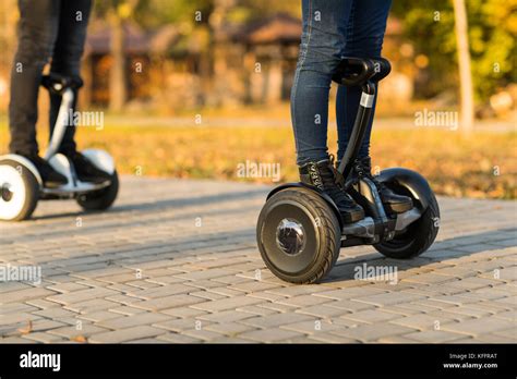 Male legs on electrical scooter outdoors gyroscooter Stock Photo - Alamy