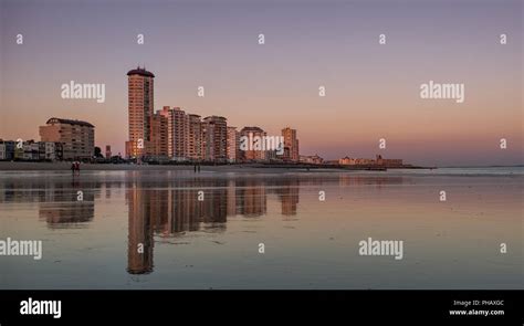 Skyline of Vlissingen reflected from beach Stock Photo - Alamy