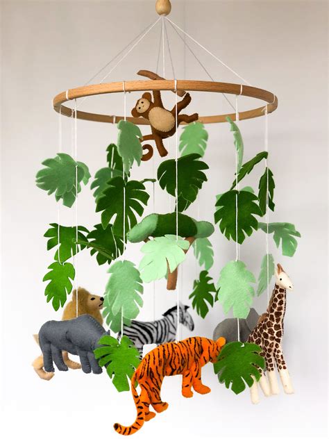 This Safari felt mobile is perfect decoration for a baby girl or baby boy nursery room. It will ...