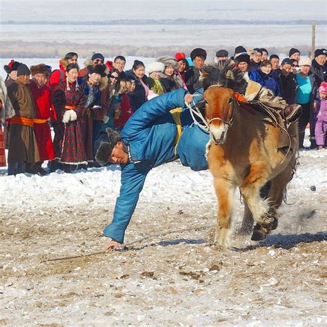 A show of horsemen's skills at the Winter Horse Festival in Mongolia ...