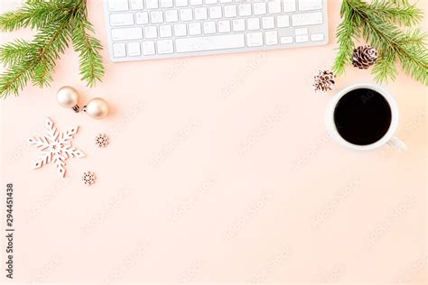 Flat lay christmas home office desk with spruce branche and keyboard ...