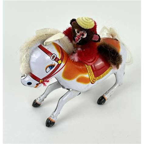 Monkey Riding Horse Tin Toy