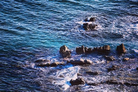 Sea and Rock Formation in Aerial Photo · Free Stock Photo