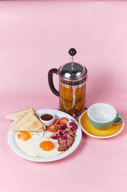 Premium Photo | Breakfast with bacon, eggs and tea