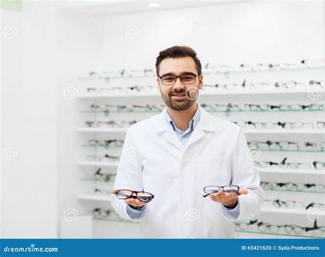 Man Optician with Glasses in Coat at Optics Store Stock Photo - Image of ophthalmologist, optic ...