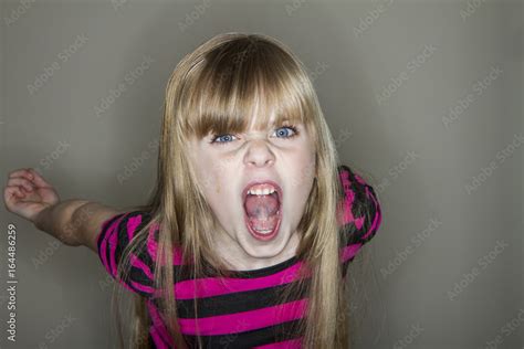 Young girl screaming at the camera Stock Photo | Adobe Stock