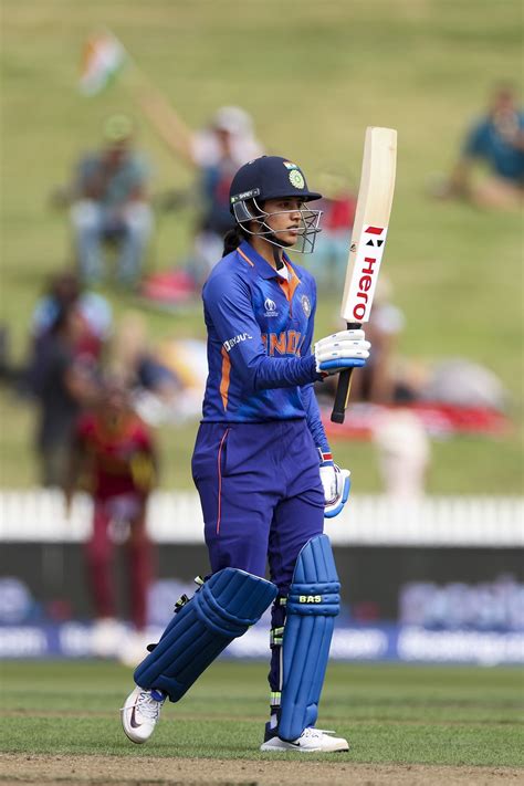 Smriti Mandhana raises the bat after her half-century | ESPNcricinfo.com