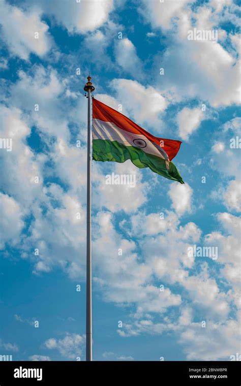 Indian national flag hoisted in the blue cloudy sky on 74th Indian ...