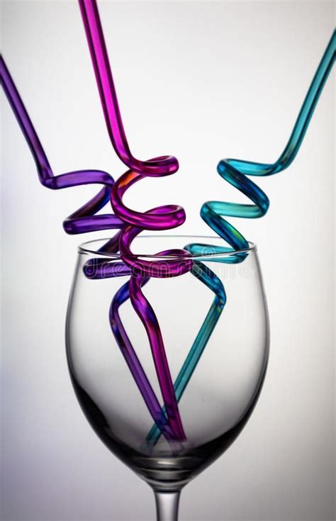 Wine glass and colourful straws. Photo of an wine glass and colourful ...