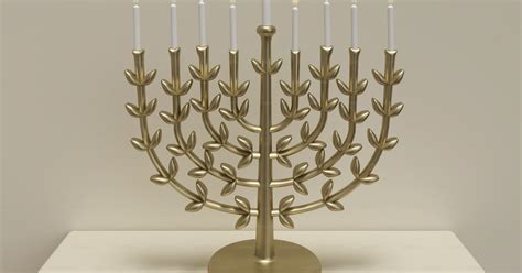 A golden menorah with lit candles on a table photo – Hanukkah Image on ...