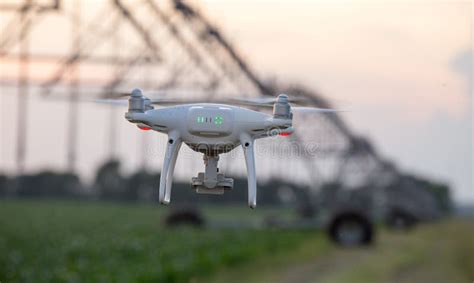 Drone Flying In Front Of Irrigation System In Field Stock Image - Image of agribusiness, modern ...