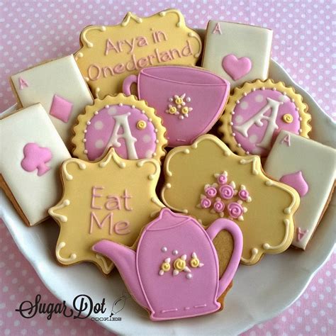 Monograms, playing cards, tea cups, tea posts, Message cookies with "Eat Me" and "Arya in ...