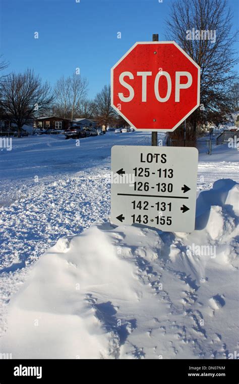 Snow covered stop sign Stock Photo - Alamy