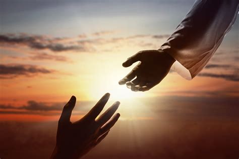 Jesus Christ Giving A Helping Hand To Human Stock Photo - Download Image Now - iStock