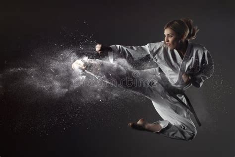 Karate Girl Bounces and Makes a Kick Stock Image - Image of defense ...