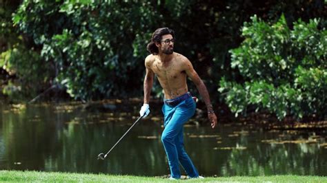 Golfer Akshay Bhatia takes off shirt to play muddy shot – twice | CNN