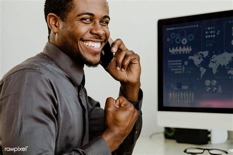 Download premium image of Happy black businessman talking on the phone