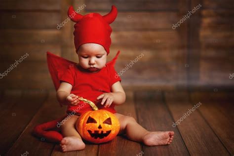 Funny baby in devil halloween costume with pumpkin Stock Photo by ...