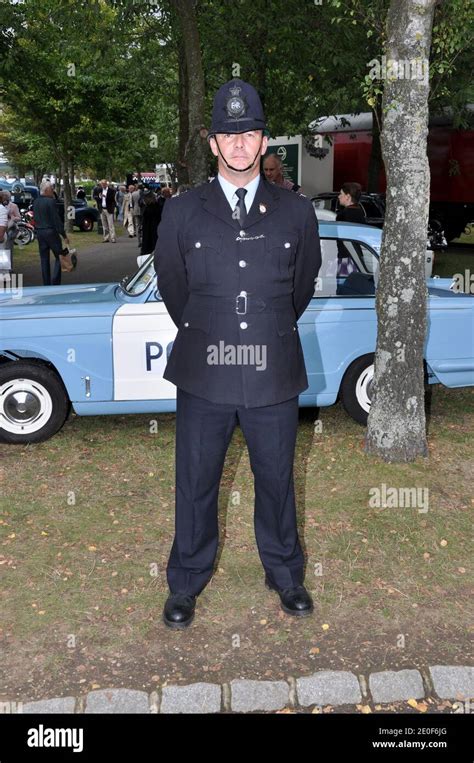 Male in vintage Police uniform costume at the Goodwood Revival, West Sussex, UK. Retro officer's ...