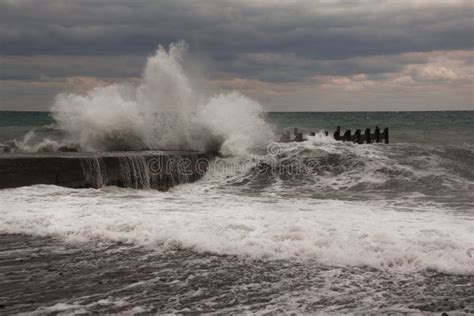 Storm Waves Over Harbor At Sea. Sea Storm With Waves Crashing Against The Pier Stock Image ...