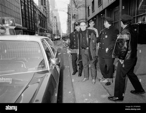 Tony Shafrazi, 30-year-old artist, is held by police outside the Museum ...