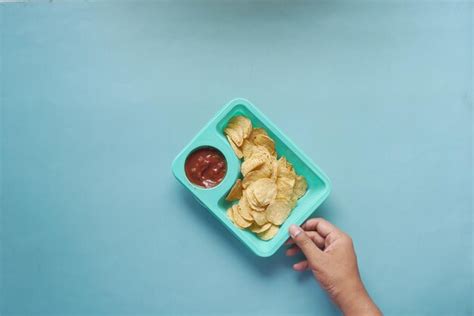 Premium Photo | A bowl of chips and salsa on table