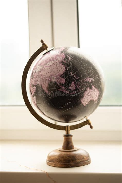 Aesthetic Globe on a White Windowsill in the Office in Front of the Window Stock Photo - Image ...