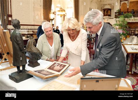 The Duchess of Cornwall and Dame Judi Dench are shown artefacts ...