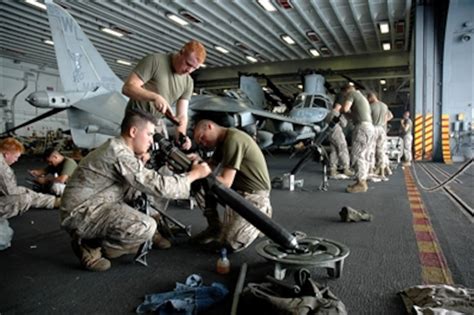 U.S. Marines perform maintenance on their equipment.