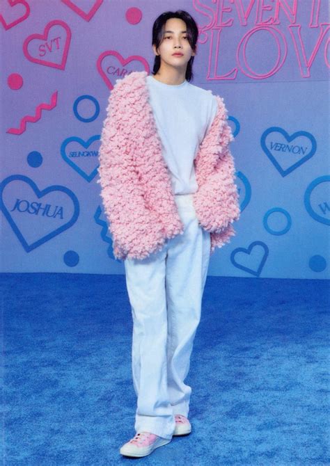 an image of a girl in pink fluffy coat and white pants at the event with hearts on