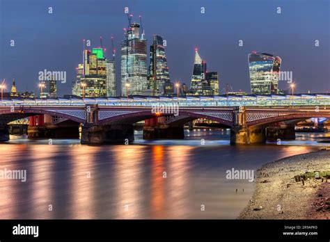 Blackfriars Bridge and the City of London skyline by night Stock Photo ...