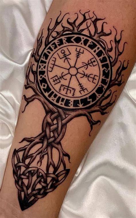 a person with a tattoo on their arm that has a clock in the middle of it