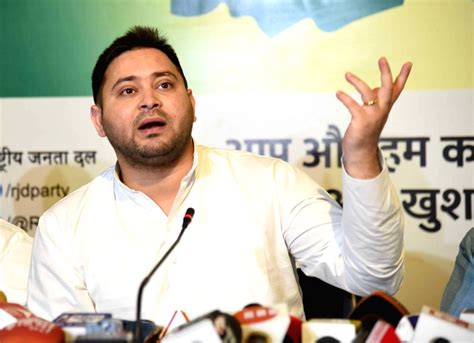 RJD leader Tejashwi Yadav addresses during a meeting