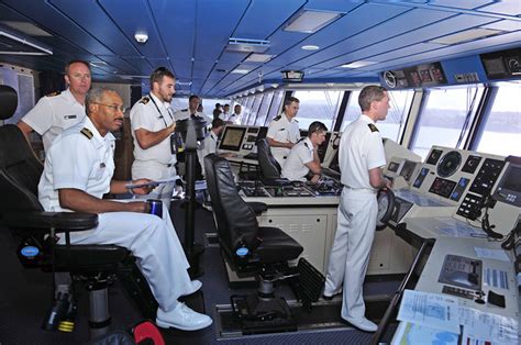 US Navy officer sits in captain's chair aboard New Zealand ship ...