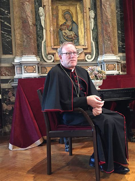 Auxiliary Bishop Robert E. Barron of Los Angeles speaks to reporters March 7, 2019, at Rome’s ...