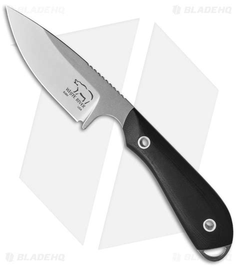 a large knife with black handles on a white background