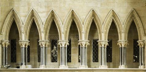 Gothic. Pointed arches along a walkway above the entrance to the ...