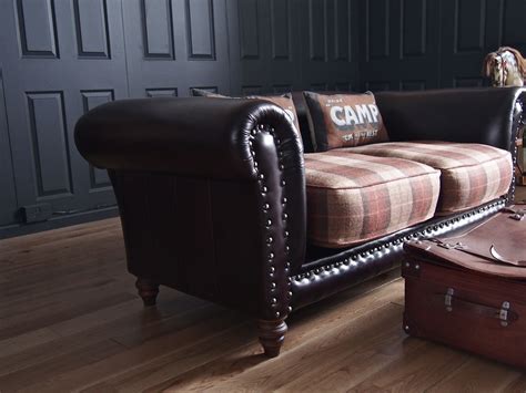 re-upholstered sofa in Tartan (plaid) and leather. This is exactly what I want to do to my two ...