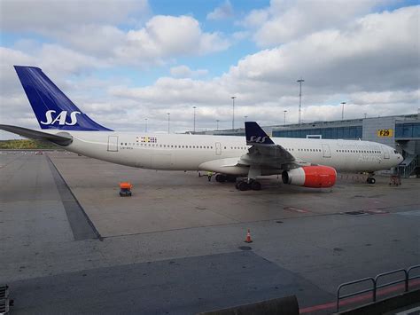 SAS A330 parked at gate Photograph by Robert Lovgren