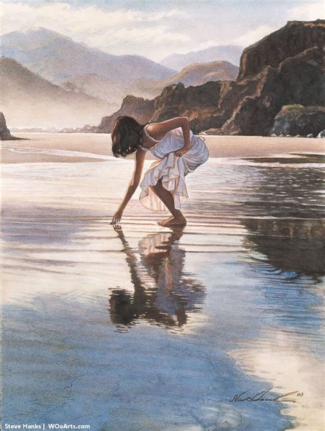 a woman bending over to pick up something from the water while standing on top of a beach