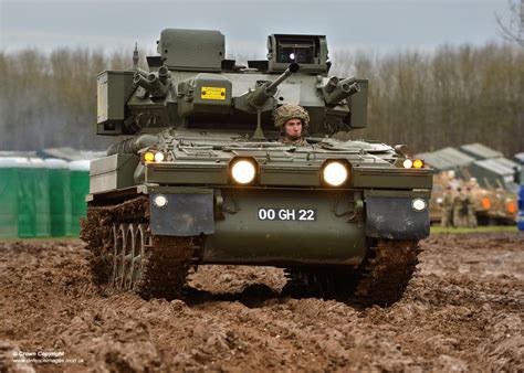 Pictured is a Scimitar making its way through the mud during Exercise TRACTABLE 2016. The ...