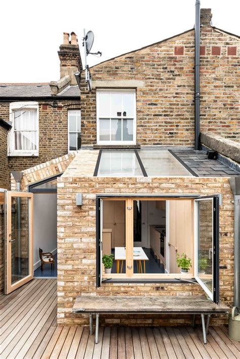 This industrial-style rear extension built onto the back of a 1920s terraced house really o ...